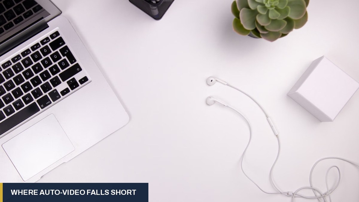 Laptop, earphones and a small white box on a clean white desk