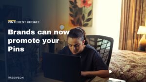 Woman working on a laptop at a home desk, with the headline Brands can now promote your Pins
